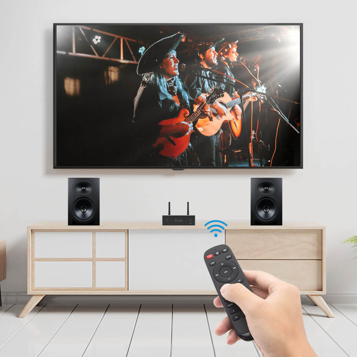 Arylic A50+ 50W x2 streaming amplifier flat lay with speaker cables and remote, neutral surfac