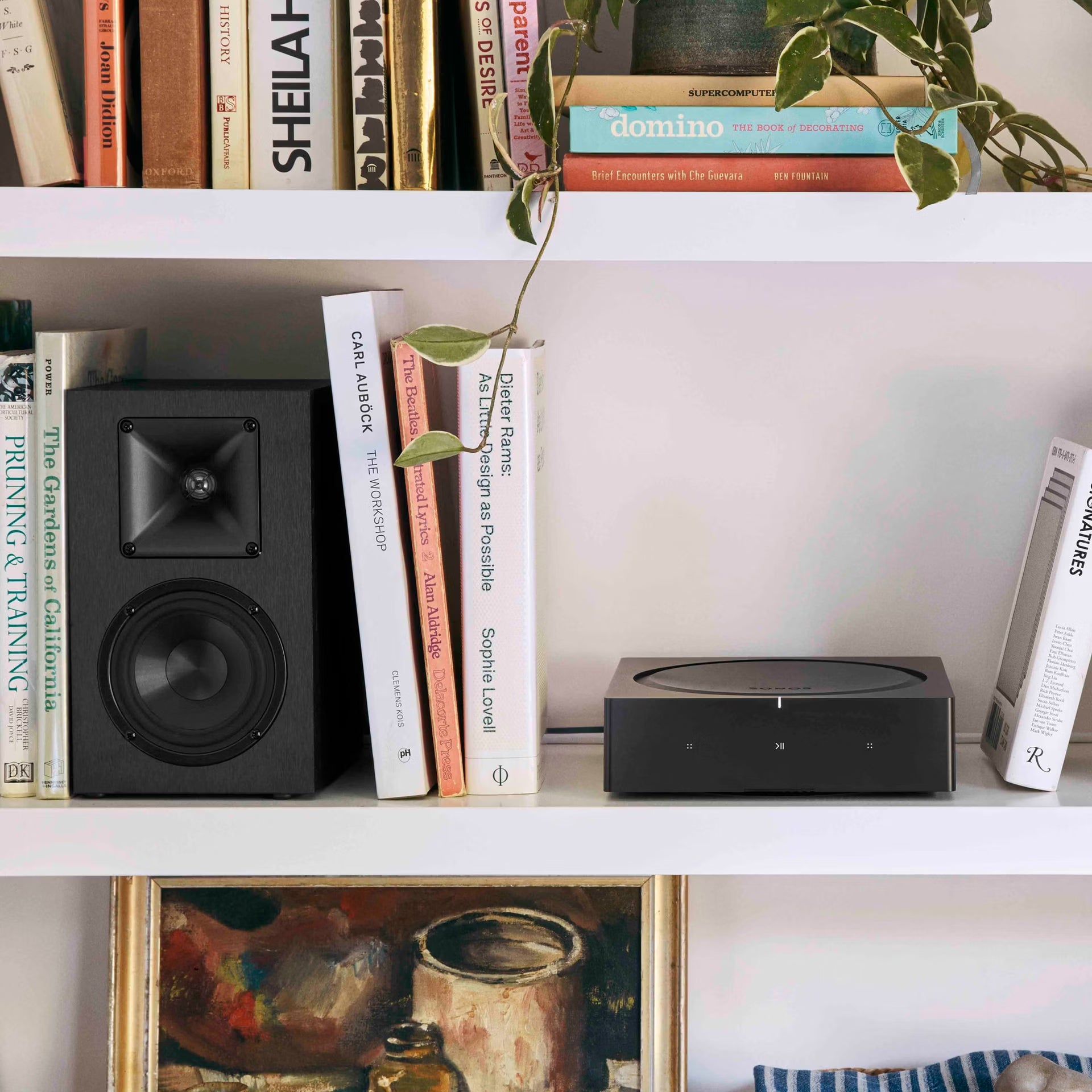 Sonos AMP installed in AV cabinet powering passive hi-fi speakers in a modern living room