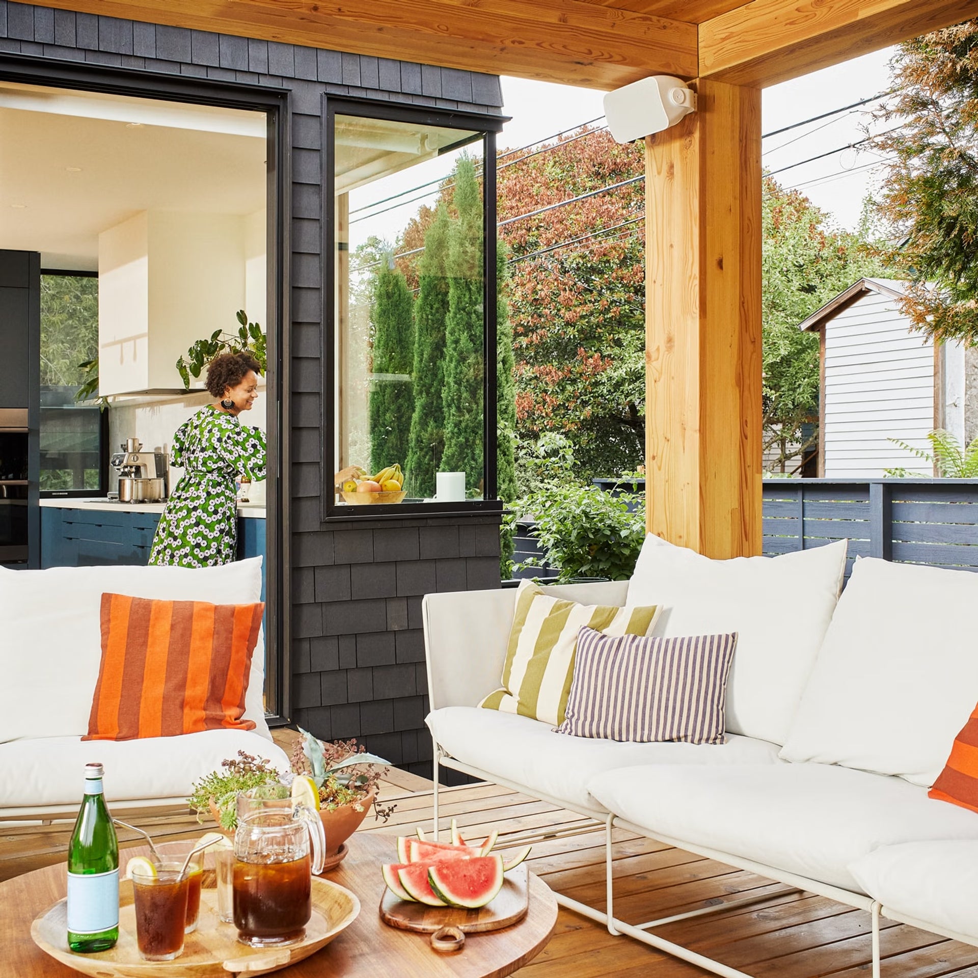Sonos Outdoor by Sonance white pair in garden — custom HiFi weatherproof loudspeakers for outdoor living