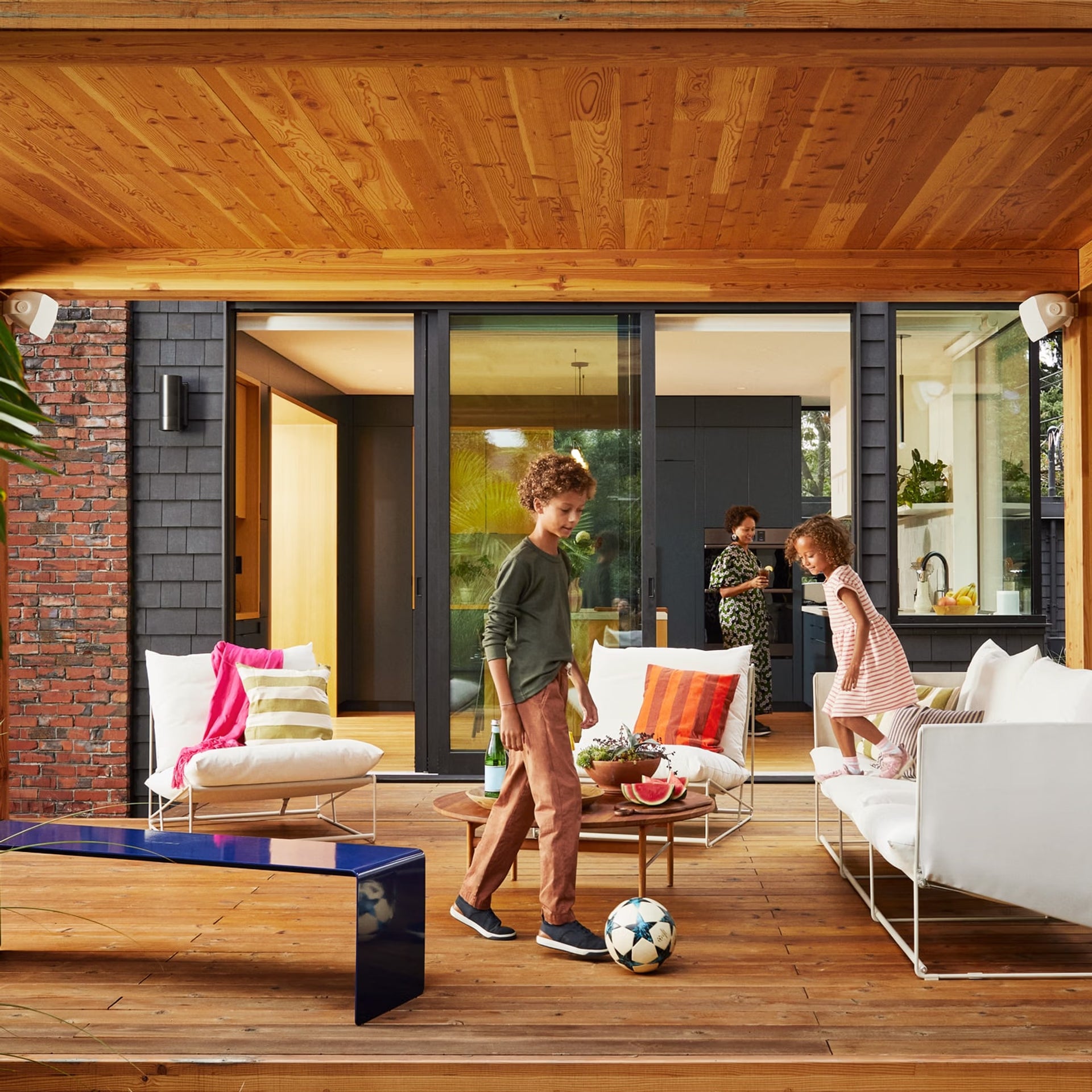 Family entertaining  with Sonos Outdoor by Sonance white — HiFi weatherproof stereo garden audio