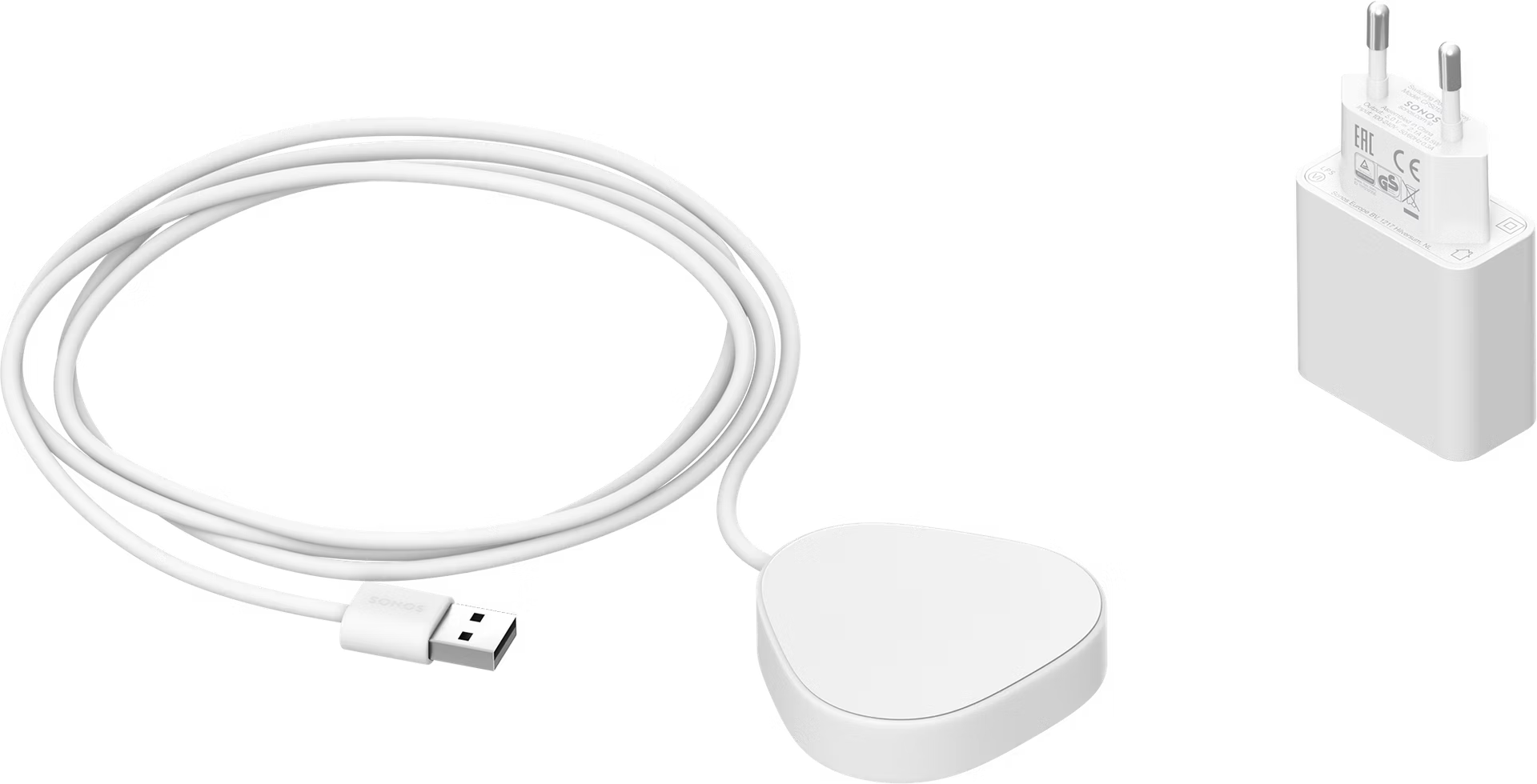 Sonos Roam white charger on bedside table — compact official wireless charging base for Sonos Roam speaker .Sonos Roam white charger in packaging