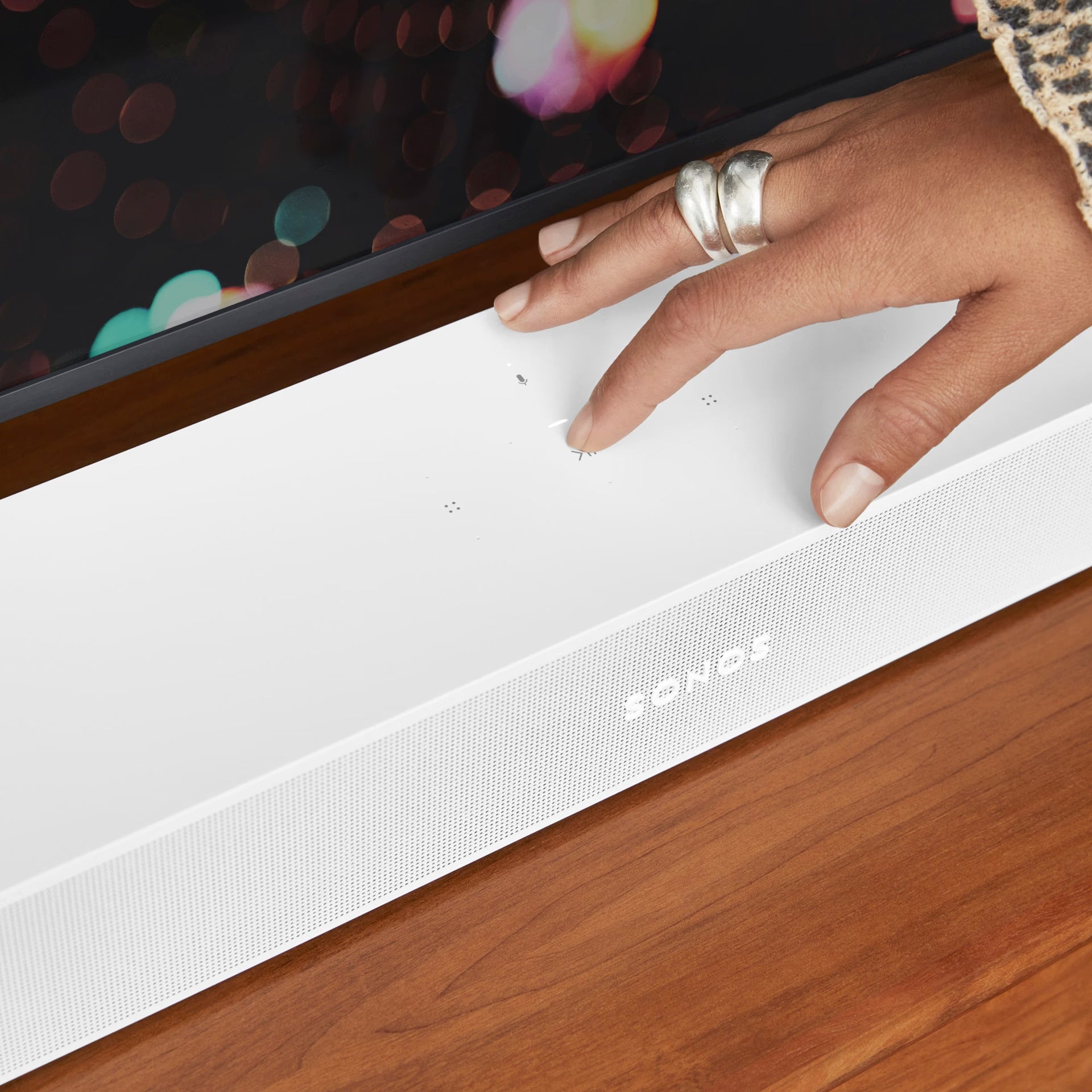 Couple enjoying TV with Sonos Beam Gen 2 white — HiFi Dolby Atmos smart soundbar for everyday audio