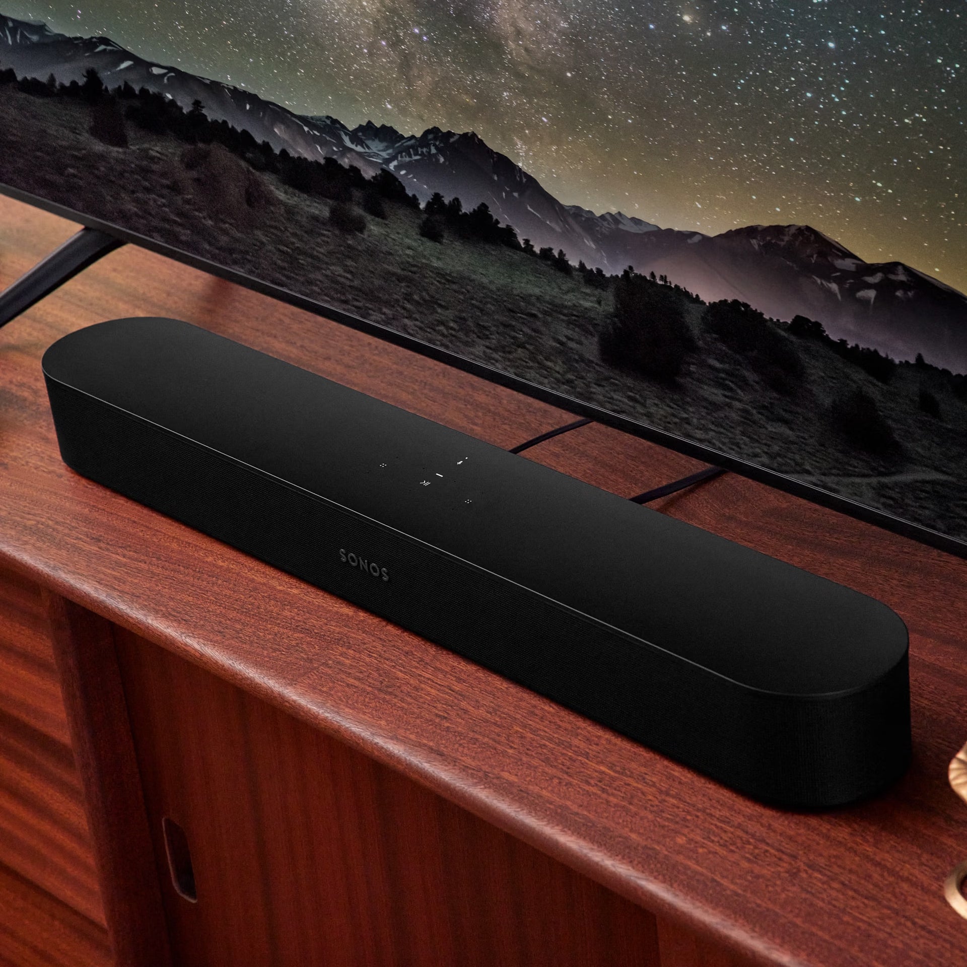 Couple enjoying TV with Sonos Beam Gen 2 black — HiFi Dolby Atmos smart soundbar for everyday audio