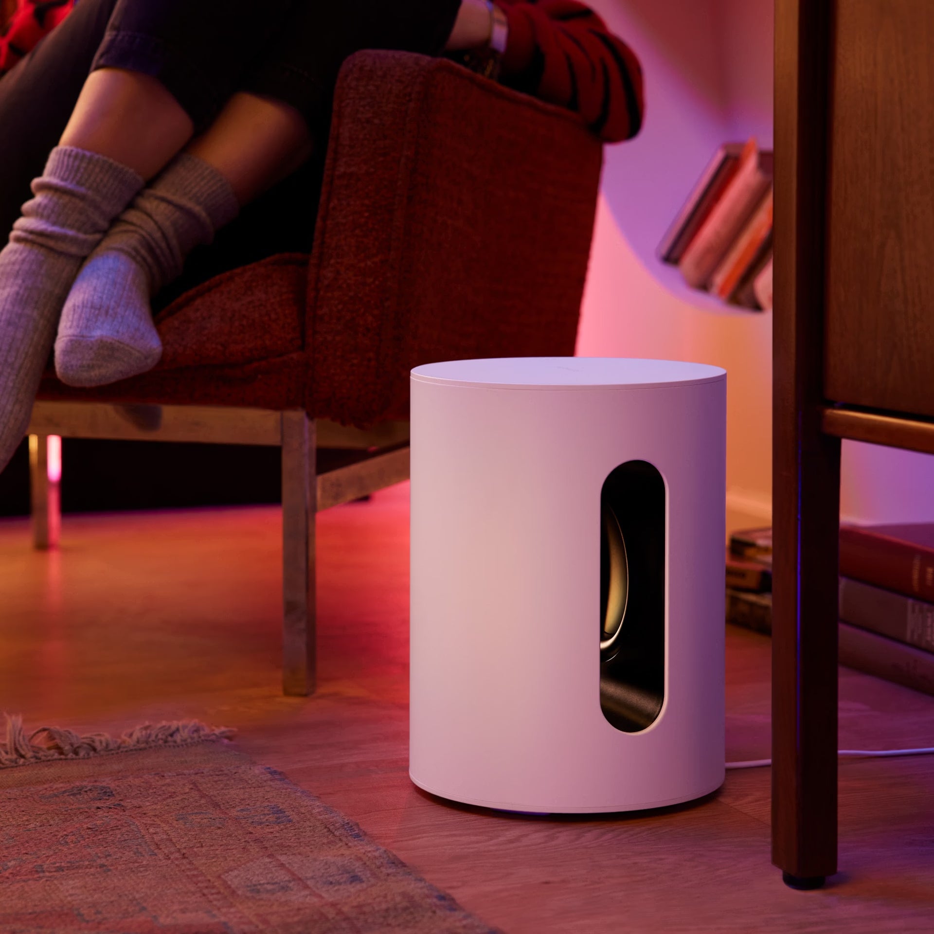 Close-up of Sonos Sub Mini white compact smart subwoofer gloss white finish and port — premium build quality for HiFi sound systems