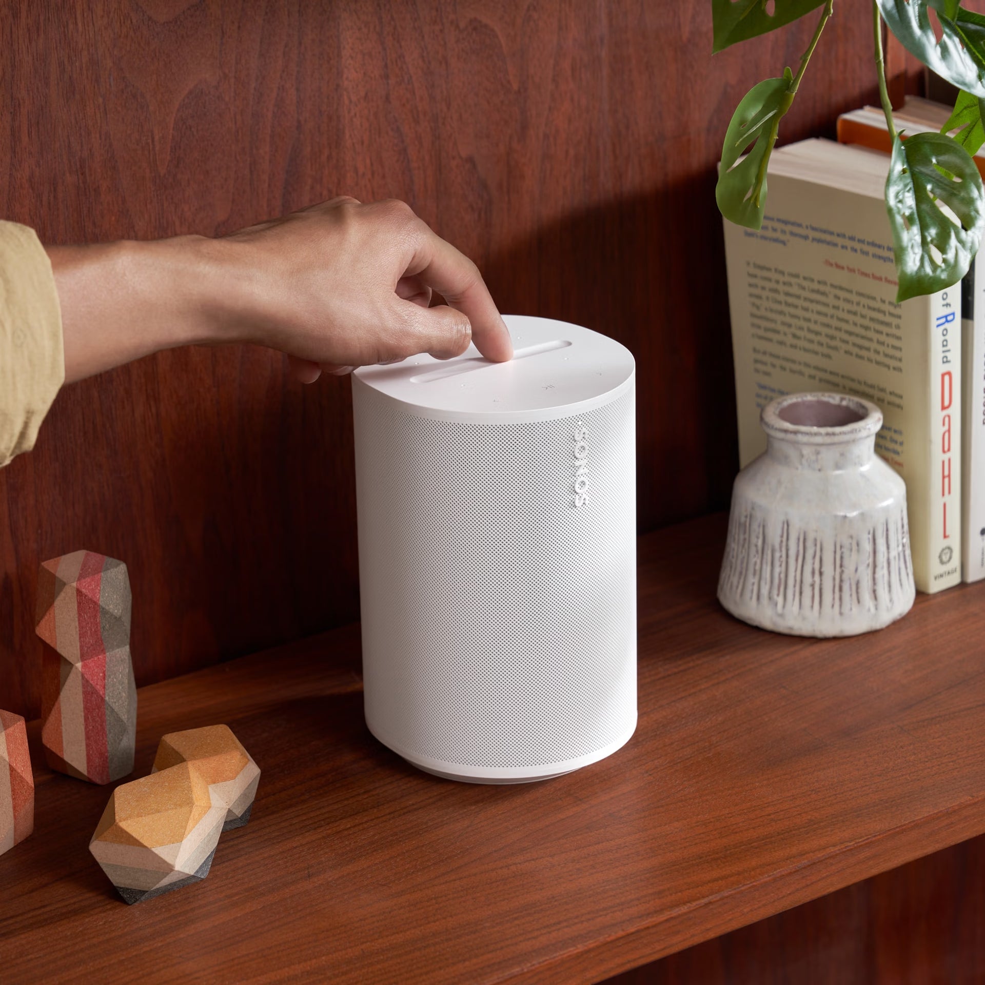 Sonos Era 100 White smart speaker on a minimal desk elevating home office audio quality