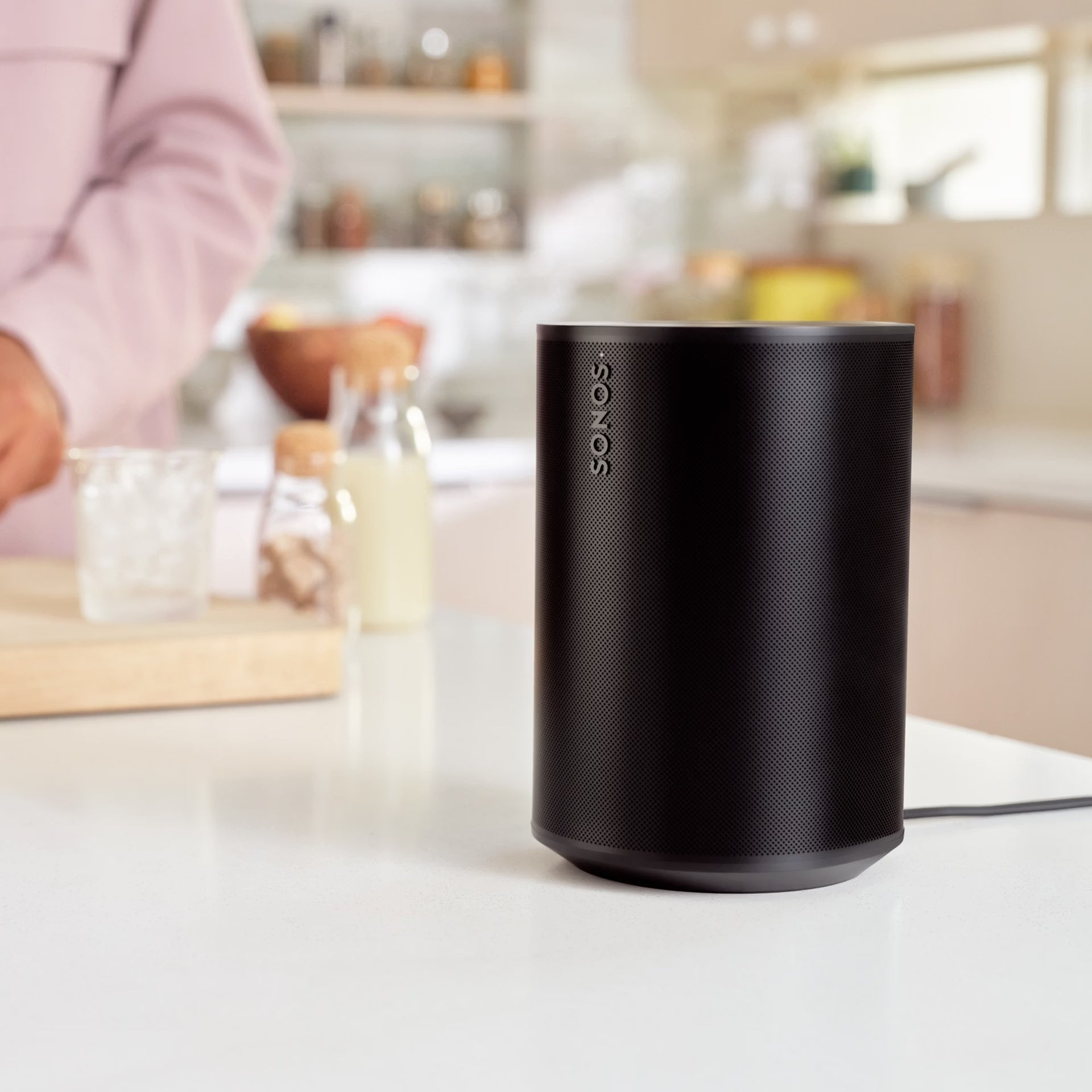 Sonos Era 100 Black HiFi smart speaker on kichen shelf filling space with rich sound