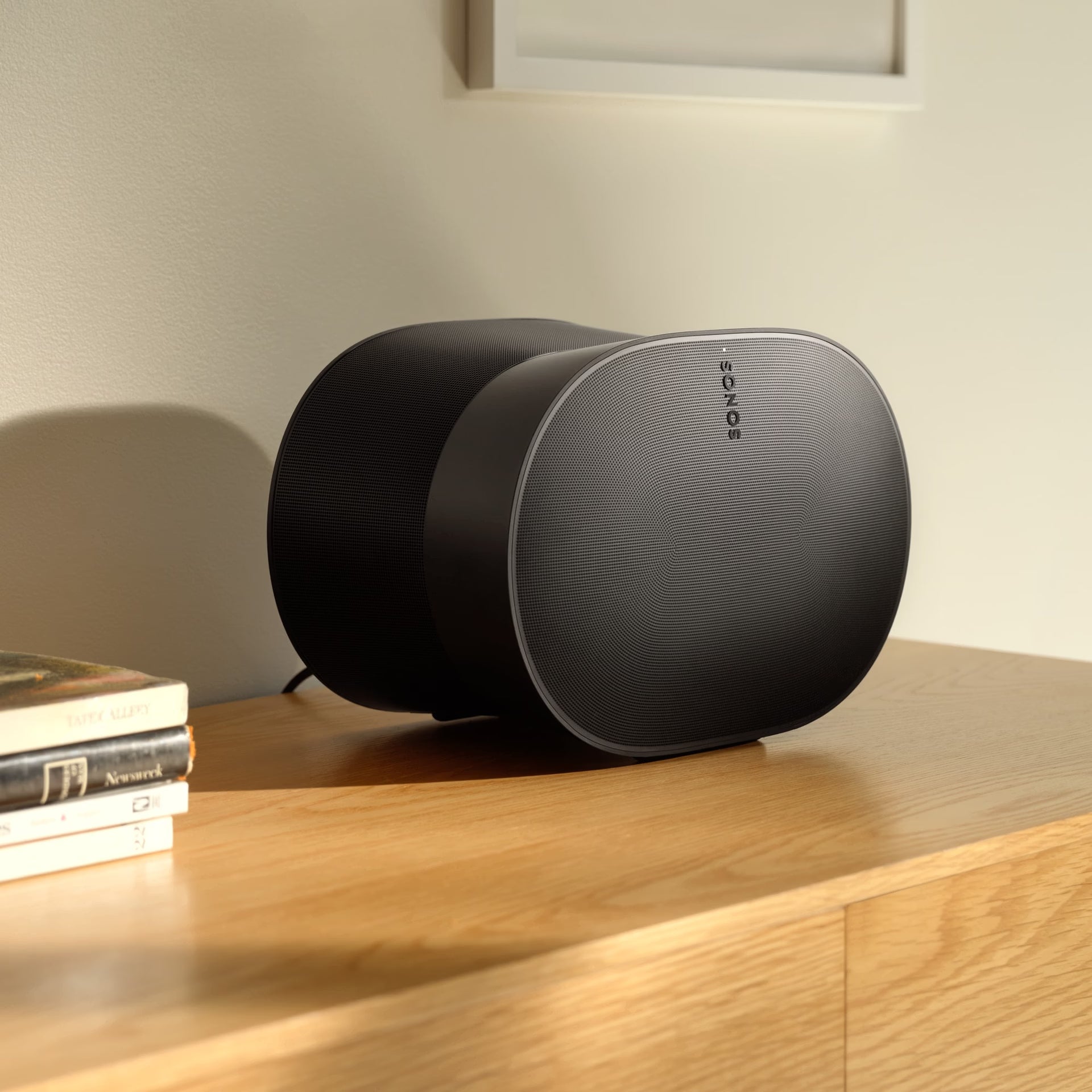 Sonos Era 300 black on desk in contemporary home office for high-fidelity spatial audio