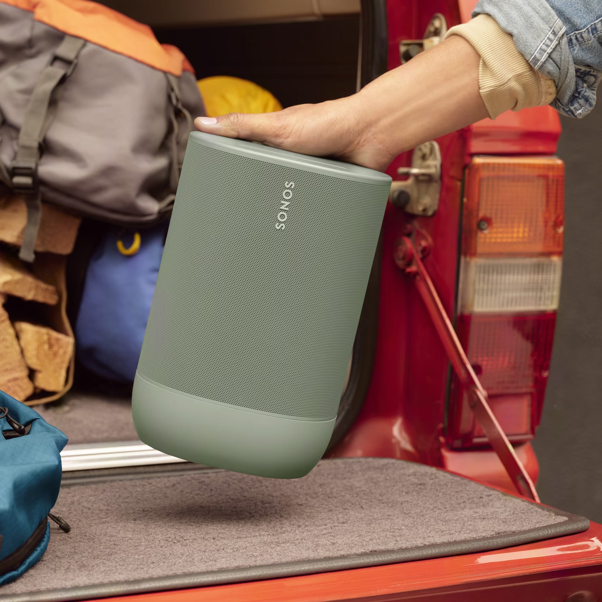 Sonos Move 2 Olive waterproof smart speaker beside a pool for all-weather outdoor audio