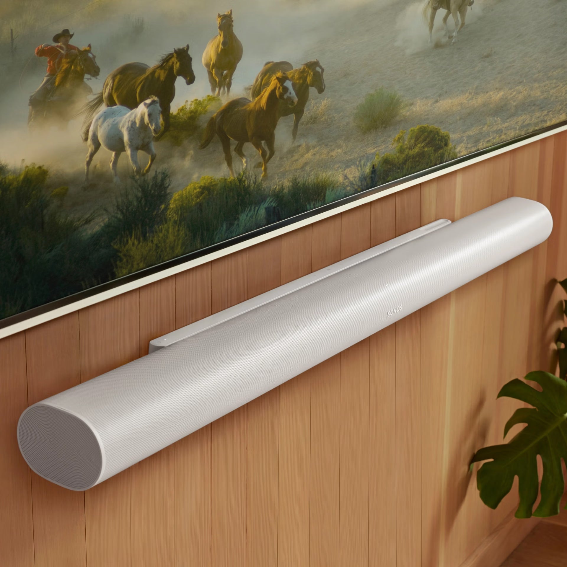 Couple enjoying Dolby Atmos with Sonos Arc Ultra white soundbar — immersive HiFi home cinema experience
