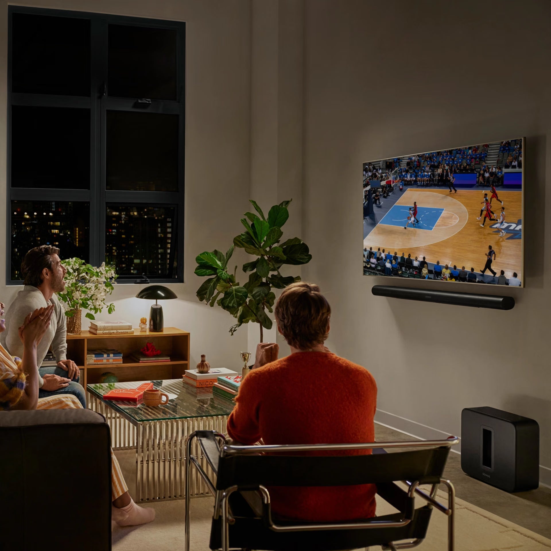 Sonos Arc Ultra black in dedicated dark home cinema room with surround sound speaker setup