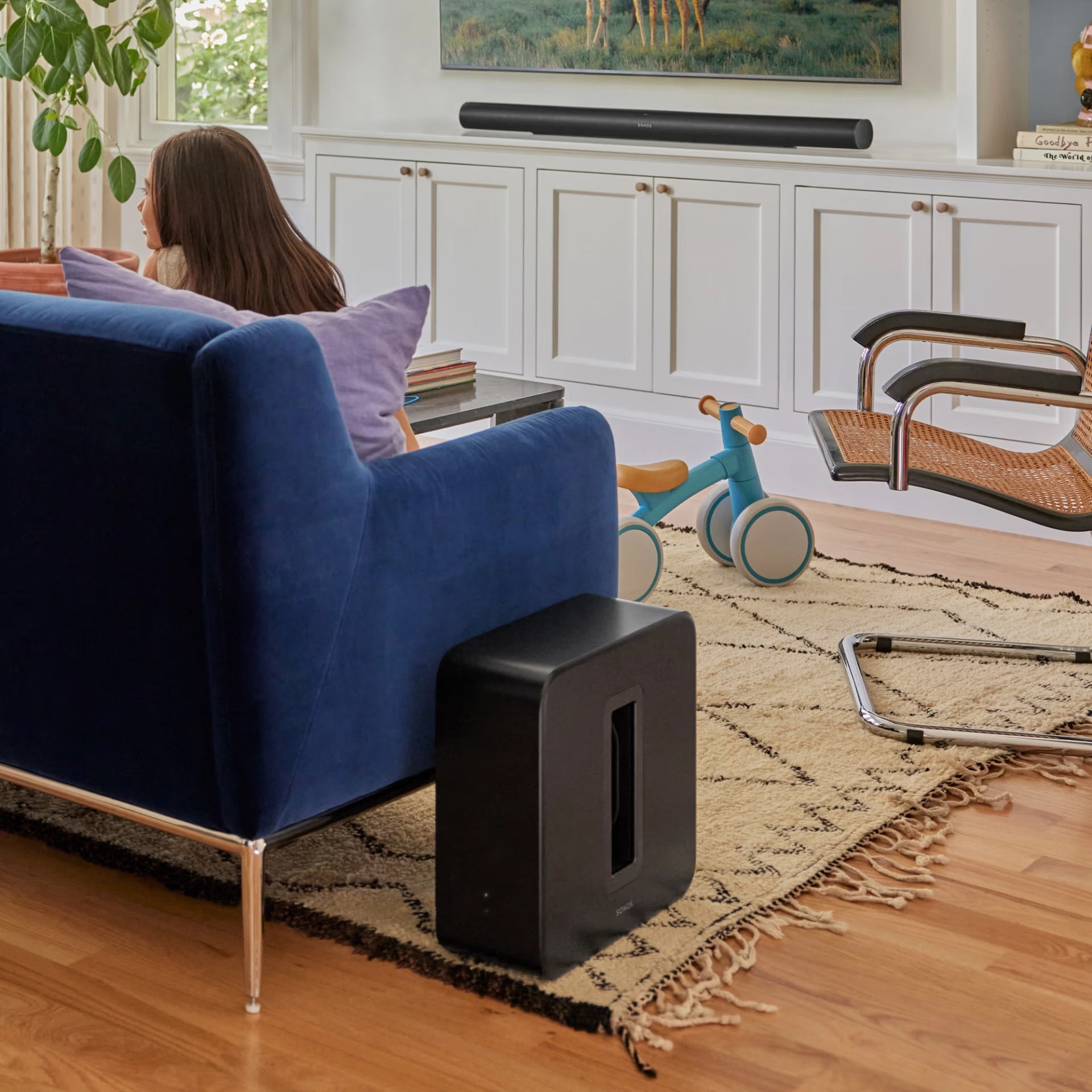 Family experiencing Sonos Sub 4 black in living room — immersive HiFi surround sound smart subwoofer