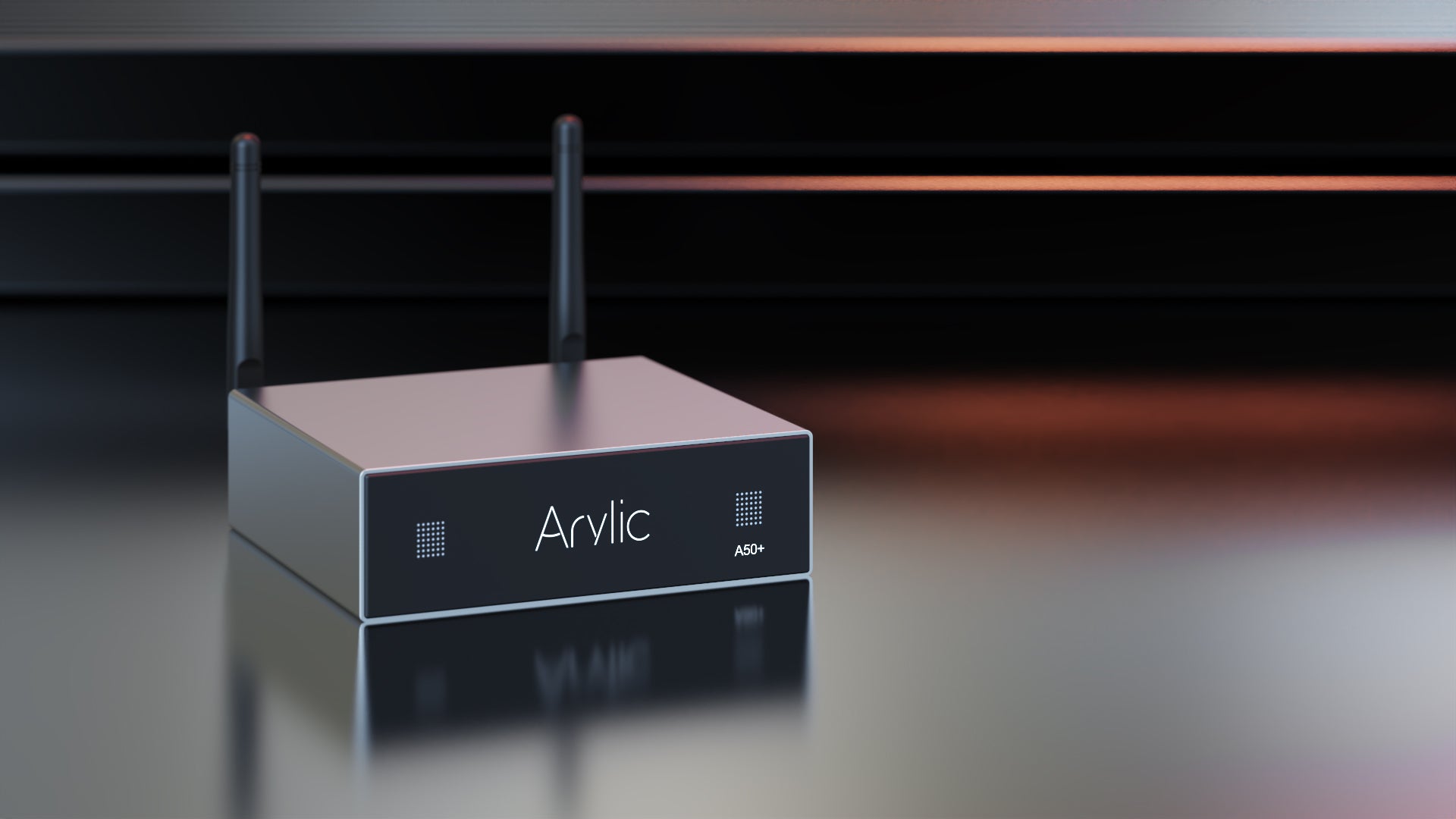 Arylic A50+ 50W x2 streaming amplifier at 45-degree angle showing front display and rear panel
