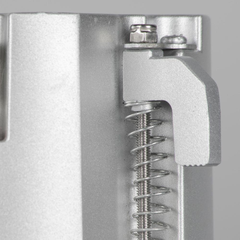 Metallic spring mechanism on a gray background
