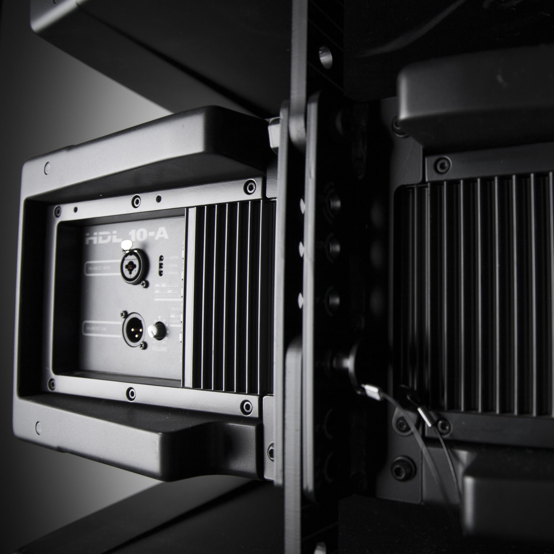 Close-up of RCF HDL 10-A Active Line Array Module quick-release rigging pins