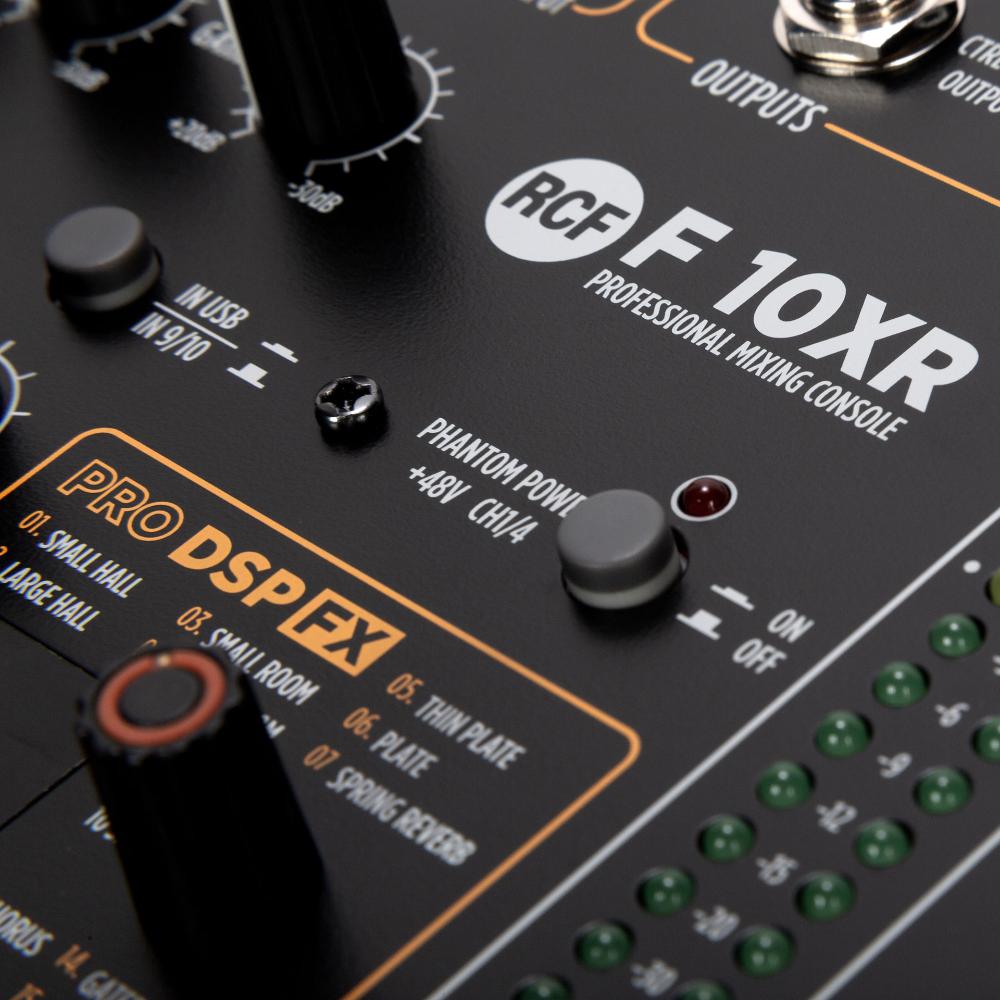 Close-up of a RCF F10XR professional mixing console with control knobs and labels.