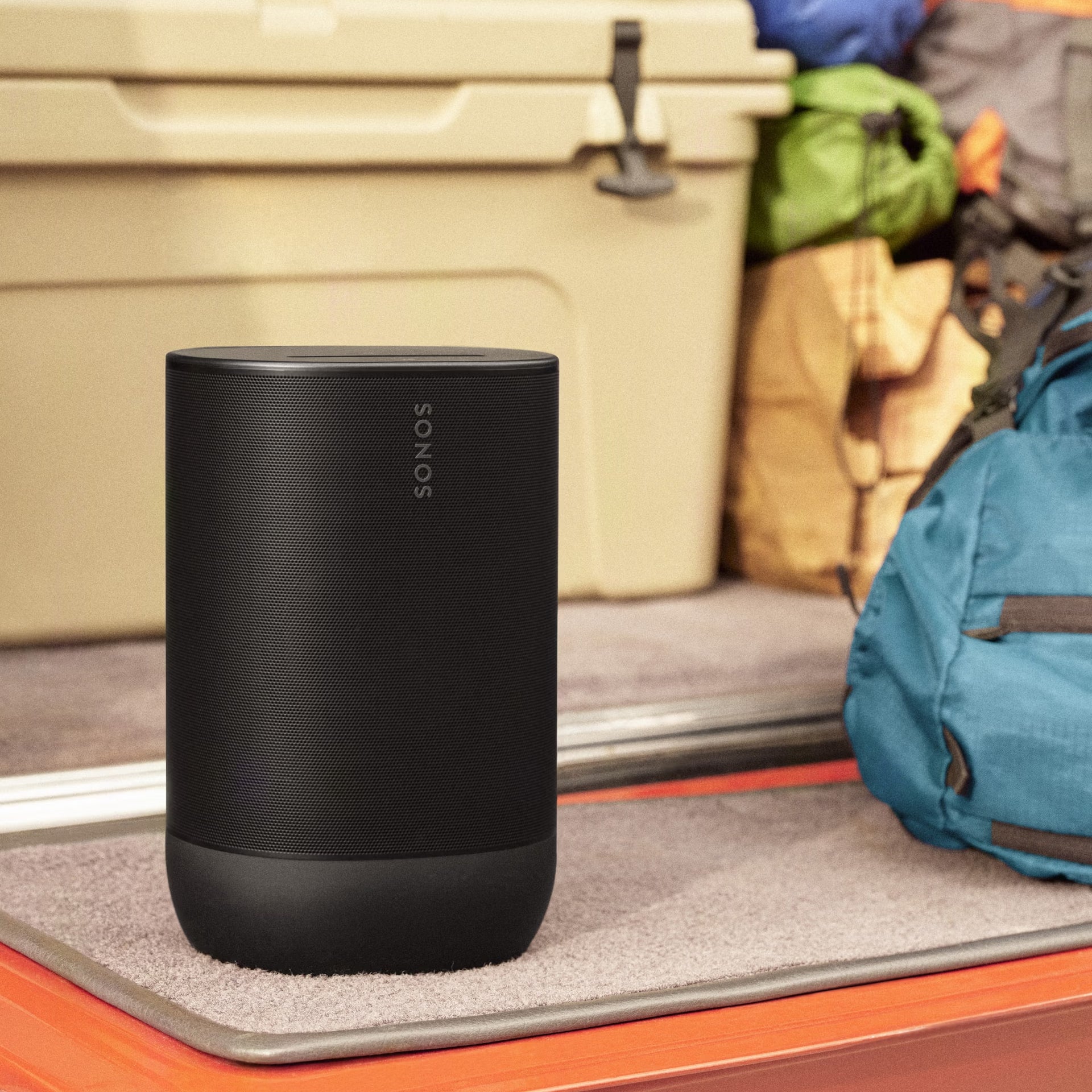 Sonos Move 2 Black on a rooftop terrace delivering powerful HiFi sound after dark