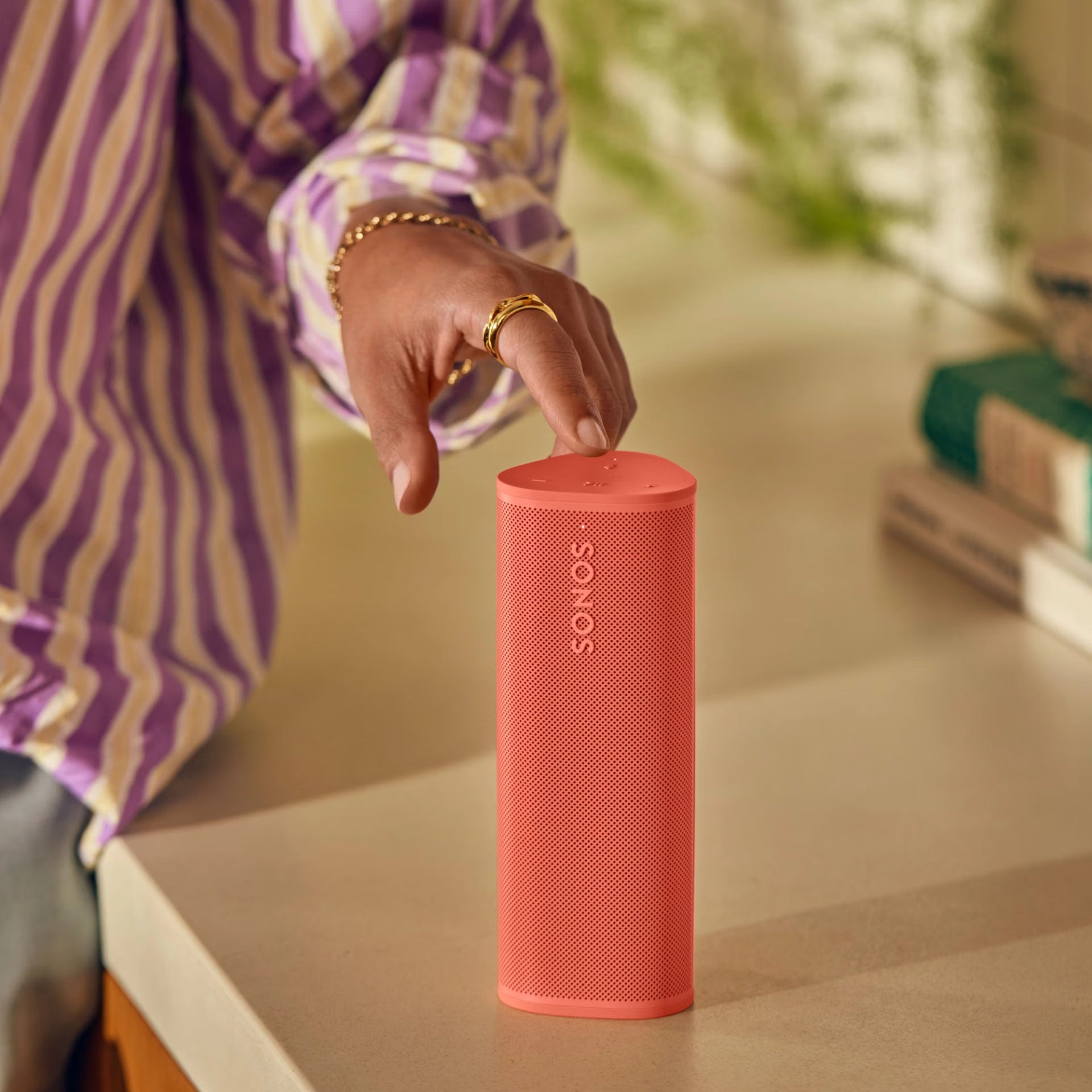 Sonos Roam 2 Red HiFi portable speaker packed in a backpack for on-the-go listening